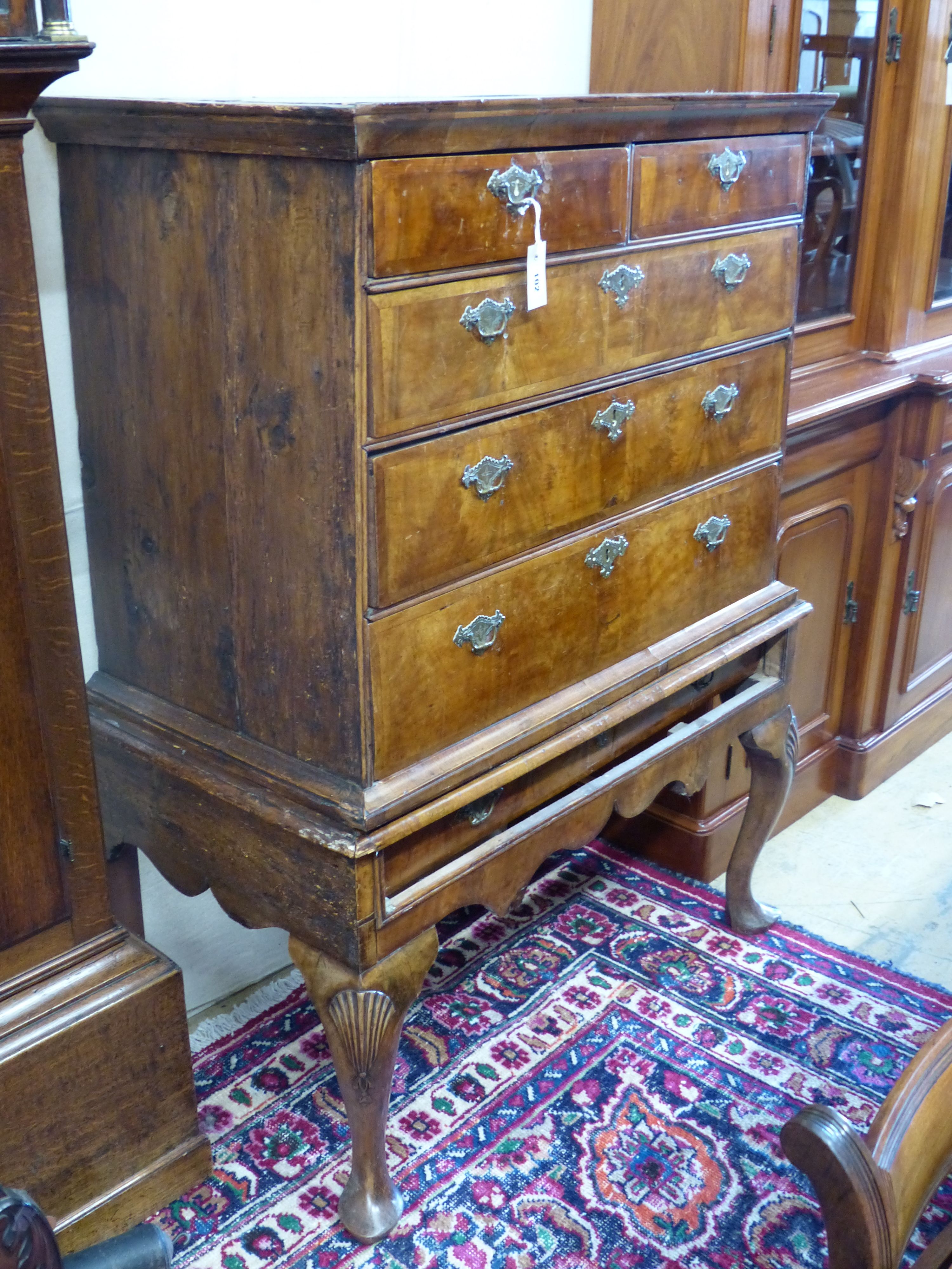 An early 18th century walnut and pine sided chest on stand, width 101cm, depth 58cm, height 138cm